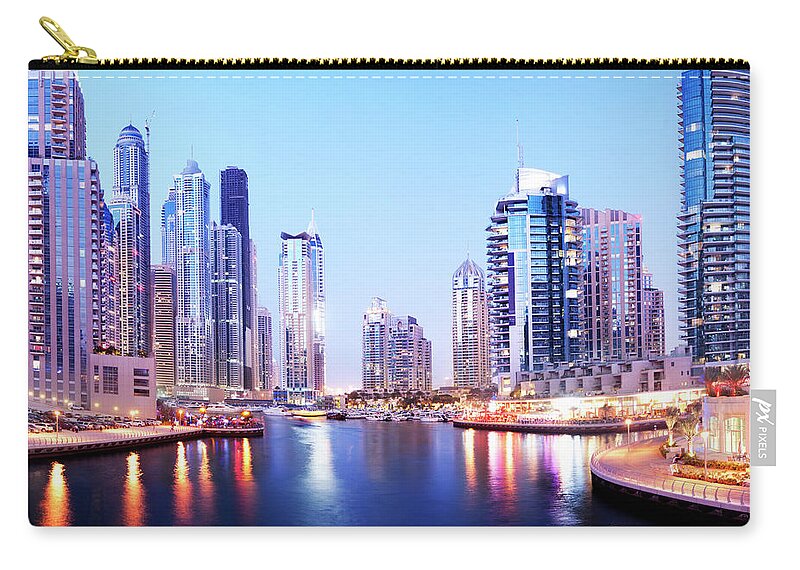 Built Structure Zip Pouch featuring the photograph Dubai Marina Skyline At Night In The by Deejpilot