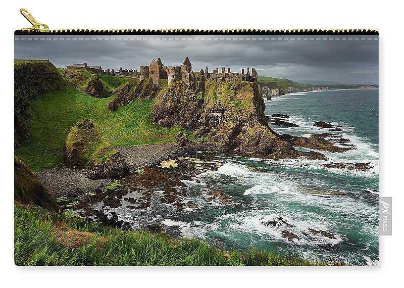 Tranquility Zip Pouch featuring the photograph Dunluce Castle, Northern Ireland by Andrea Pistolesi