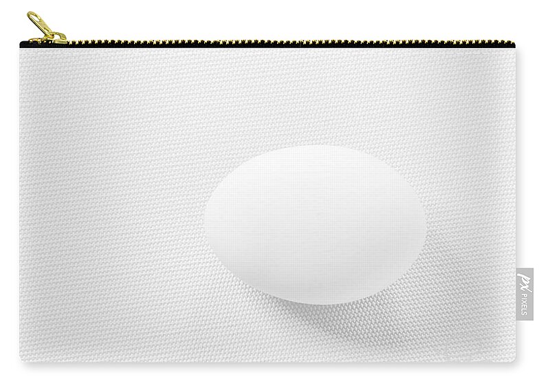 White Zip Pouch featuring the photograph Egg on White Tablecloth by Ludwig Keck