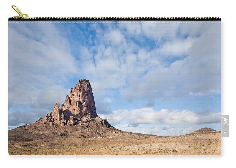Arid Climate Zip Pouch featuring the photograph Evening Light on Agathla Peak by Jeff Goulden