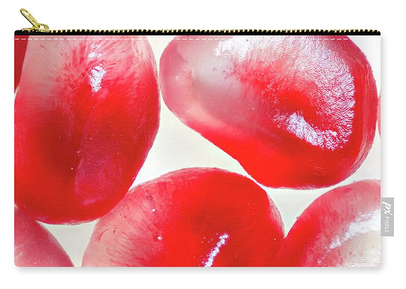 Pomegranate Zip Pouch featuring the photograph Extreme Close-up Of Organic Pomegranate by Robert George Young