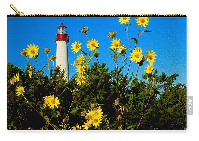 Lighthouse Zip Pouch featuring the photograph Fall Flowers at the Light by Nick Zelinsky Jr