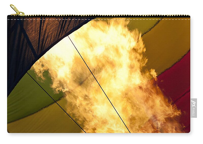 Balloon Zip Pouch featuring the photograph Flames Burst Out as a Hot Air Balloon is Being Inflated by Brandon Alms