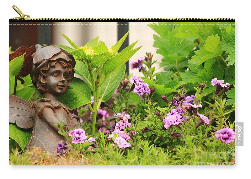 Angel Carry-all Pouch featuring the photograph Flower-bed mit an angel statue by Amanda Mohler