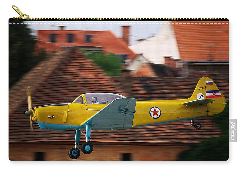 Fly Zip Pouch featuring the photograph Flying low by Ivan Slosar