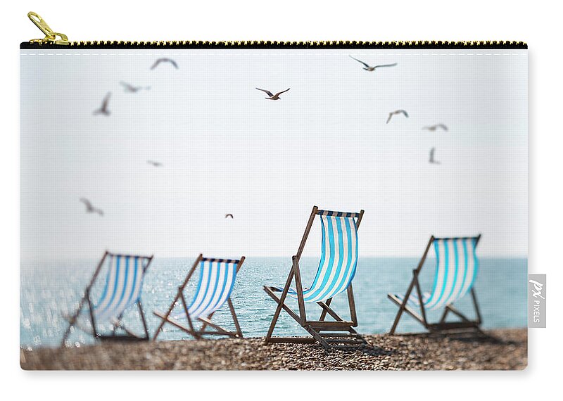 Tranquility Zip Pouch featuring the photograph Four Deckchairs On A Beach And Seagulls by Richard Boll