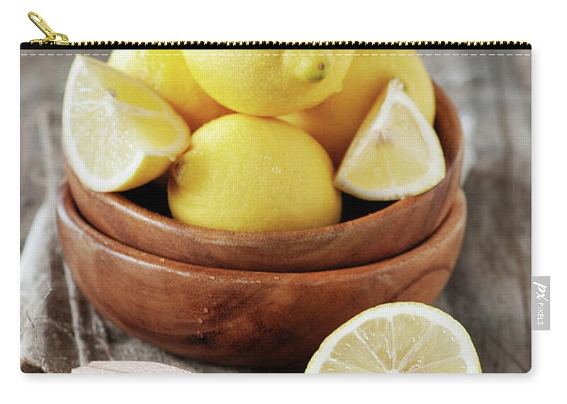 Napkin Zip Pouch featuring the photograph Fresh Lemons by Oxana Denezhkina