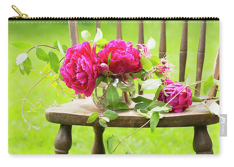 Pink Zip Pouch featuring the photograph Fresh Pink Peonies Picked And Lying by Laura Bartlett