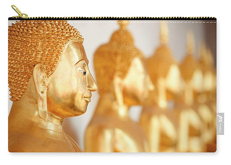 Tranquility Zip Pouch featuring the photograph Golden Buddha Statue by Fred Froese