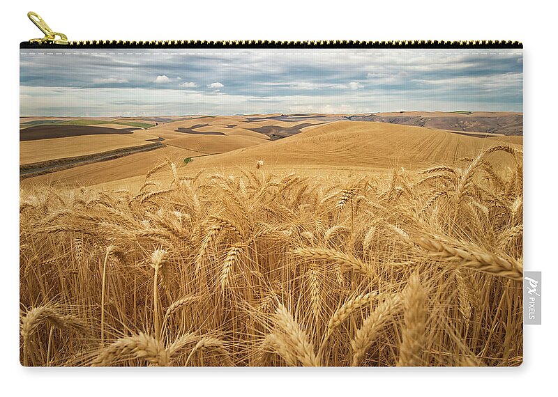 Field Zip Pouch featuring the photograph Golden Wheat Fields On Rolling Hills by Marg Wood
