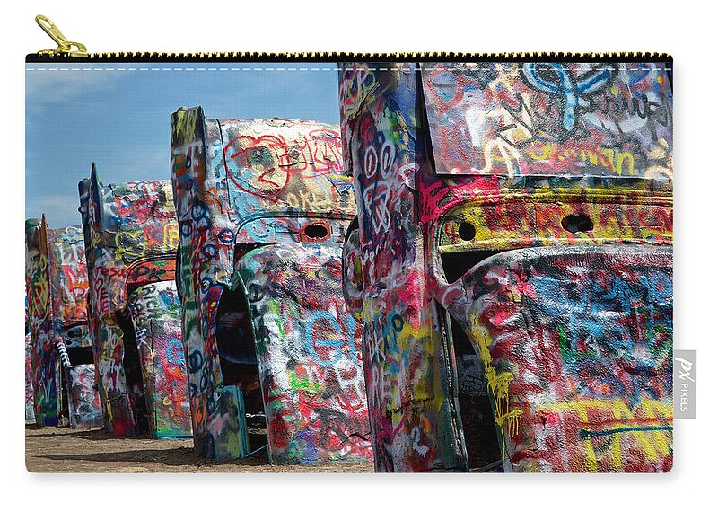 Cadillac Ranch Carry-all Pouch featuring the photograph Graffiti at the Cadillac Ranch Amarillo Texas by Mary Lee Dereske