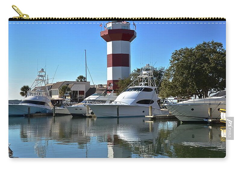 Lighthouse Zip Pouch featuring the photograph Harbor Town Lighthouse by Carol Bradley
