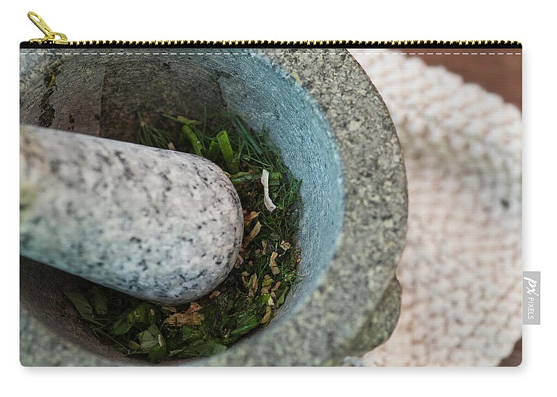 Mortar And Pestle Zip Pouch featuring the photograph Herbs Being Ground In Pestle And Mortar by Luka