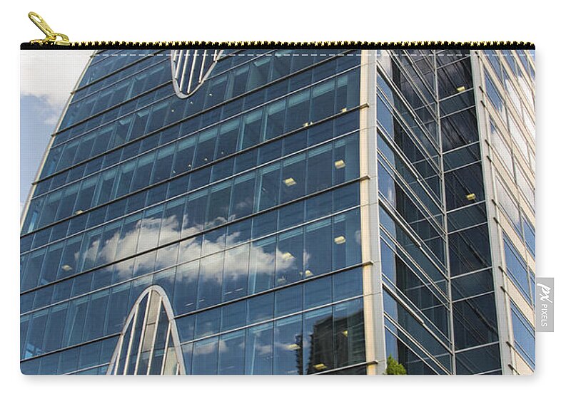 Hunt Oil Tower Zip Pouch featuring the photograph Hunt Oil Tower by Bob Phillips