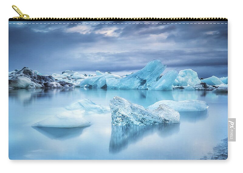 Glacier Lagoon Zip Pouch featuring the photograph Icebergs In Jokulsarlon Lagoon by Sandro Bisaro
