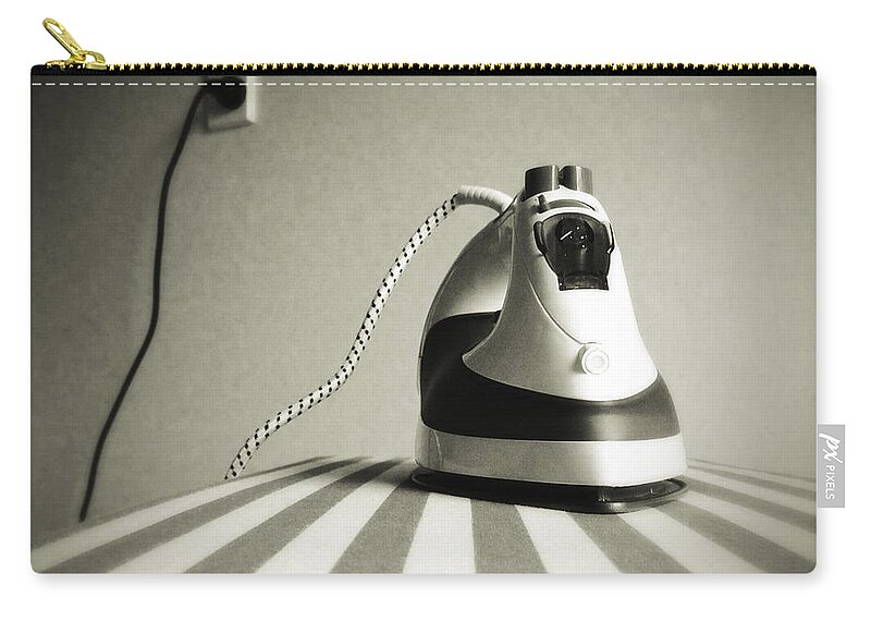 Retro Zip Pouch featuring the photograph Iron by Les Cunliffe