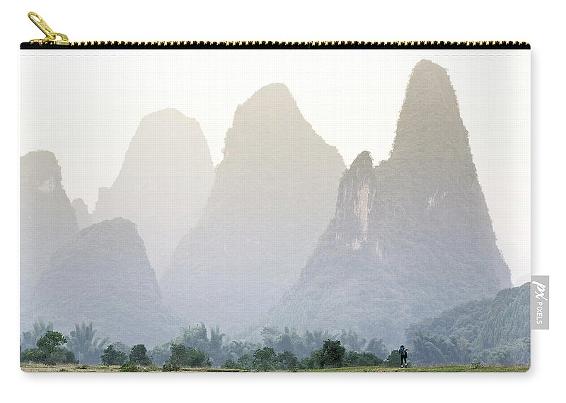 Scenics Zip Pouch featuring the photograph Karst Mountains Surrounding Li River by Merten Snijders