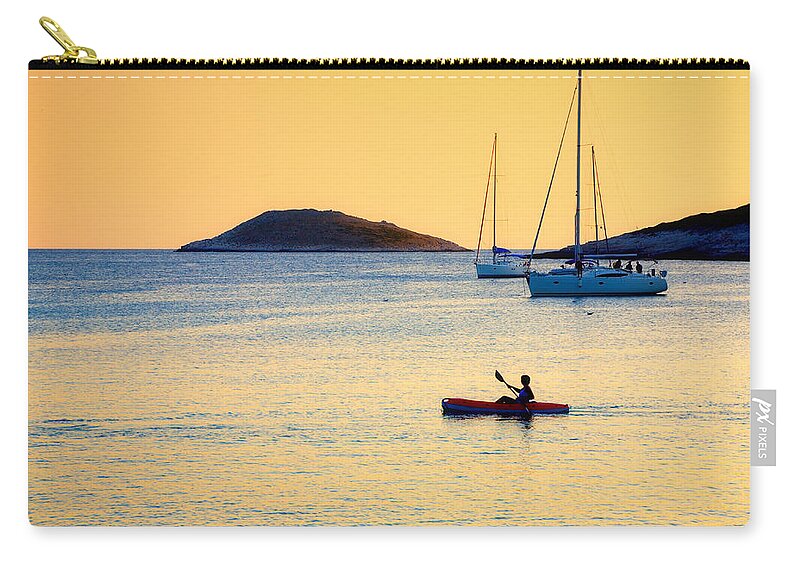Kayak Zip Pouch featuring the photograph Kayaker by Alexey Stiop