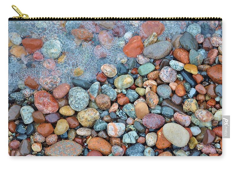 Lake Superior Stones Zip Pouch featuring the photograph Lake Superior Stones and Wave by Kathryn Lund Johnson