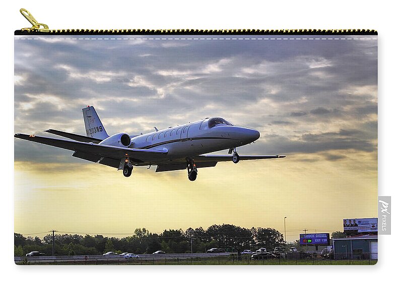 Airplane Zip Pouch featuring the photograph Landing at Sunrise by Jason Politte