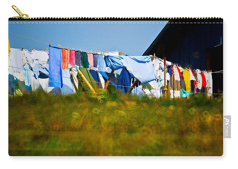 Photography Zip Pouch featuring the photograph Laundry Hanging On The Line To Dry by Panoramic Images