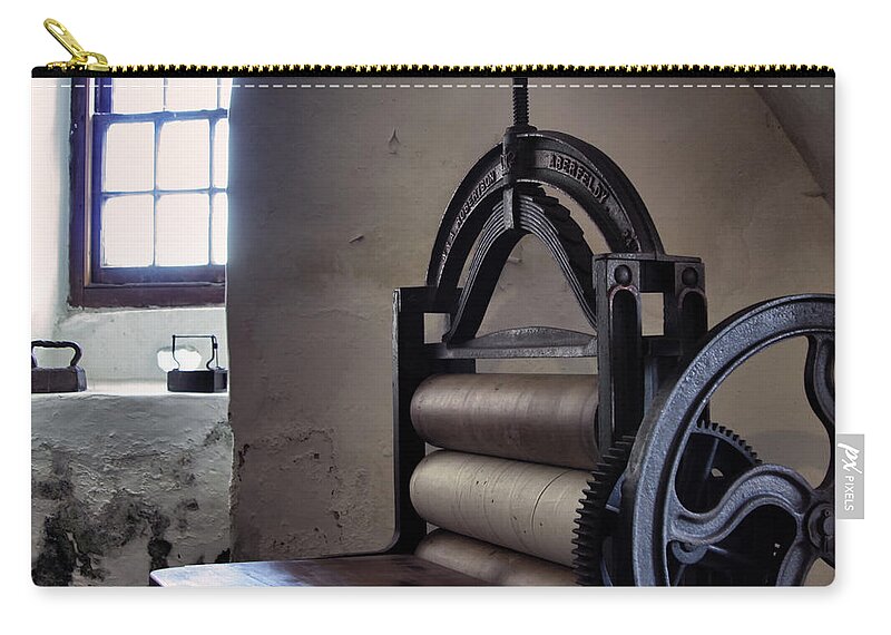 Antique Zip Pouch featuring the photograph Laundry Press by Jason Politte