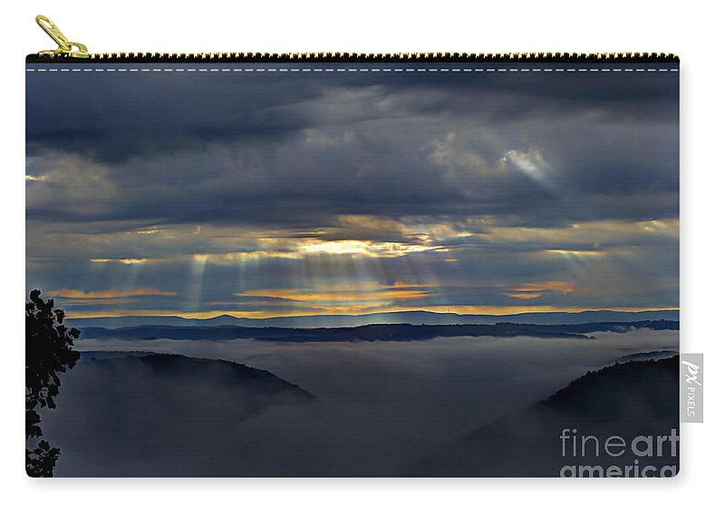 Clouds Zip Pouch featuring the photograph Light streaming through clouds on foggy morning by Dan Friend