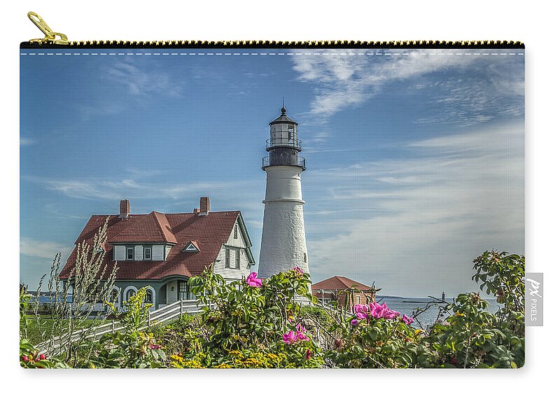 Maine Zip Pouch featuring the photograph Lighthouse and wild roses by Jane Luxton