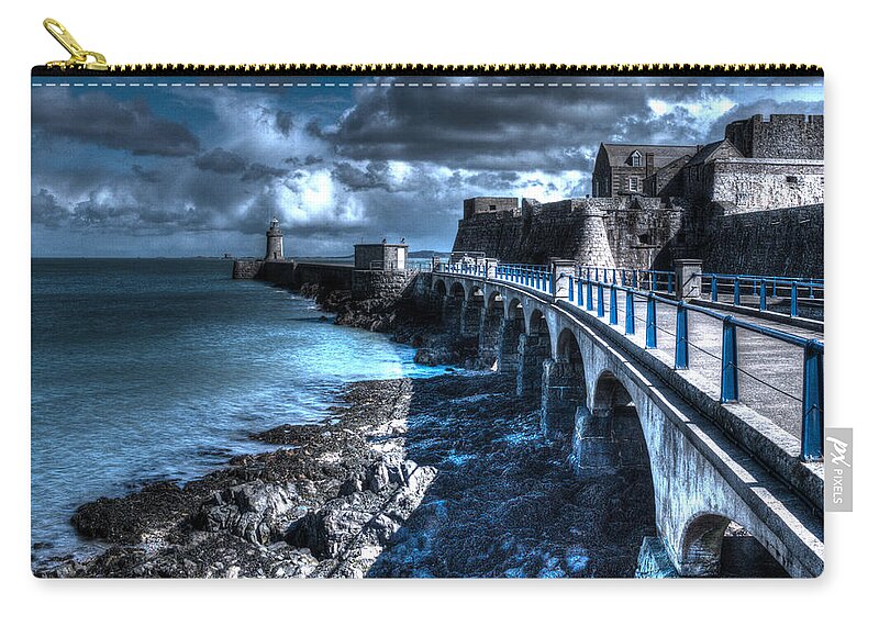 Guernsey Lighthouse Zip Pouch featuring the photograph Lighthouse by Chris Smith