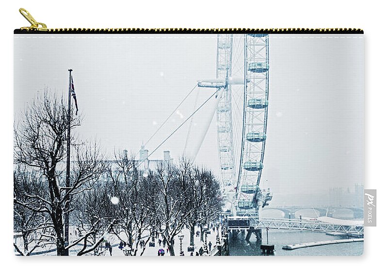 Snow Zip Pouch featuring the photograph London Eye And Southbank In Snow by Doug Armand