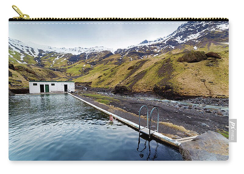 South Central Iceland Zip Pouch featuring the photograph Lone Tourist At Seljavallalaug Pool by Anna Gorin