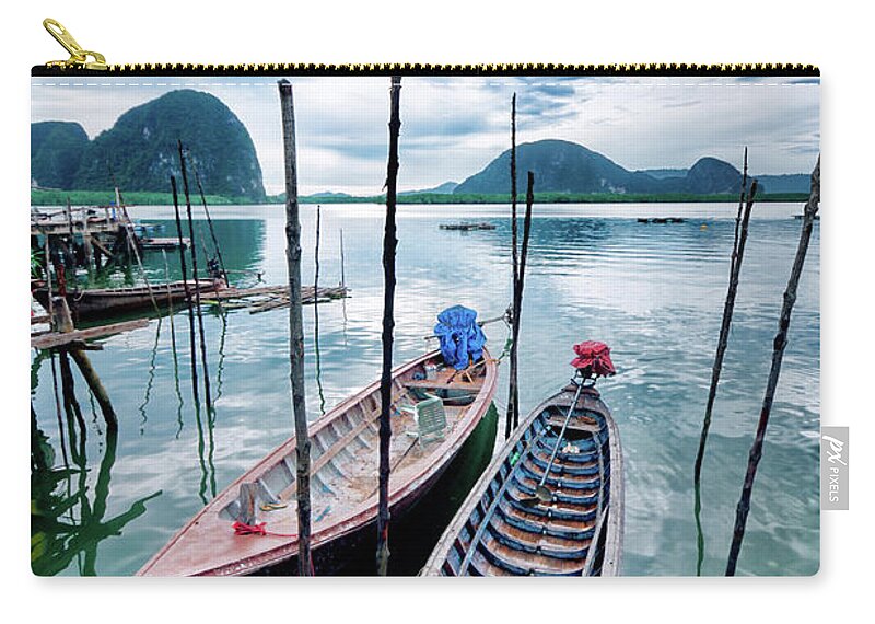 Water's Edge Zip Pouch featuring the photograph Longtail Wooden Fishing Boat In Phuket by Aleksandargeorgiev