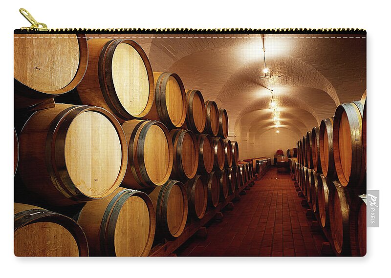 Alcohol Zip Pouch featuring the photograph Lots Of Future Wine Oak Barrels by Rapideye