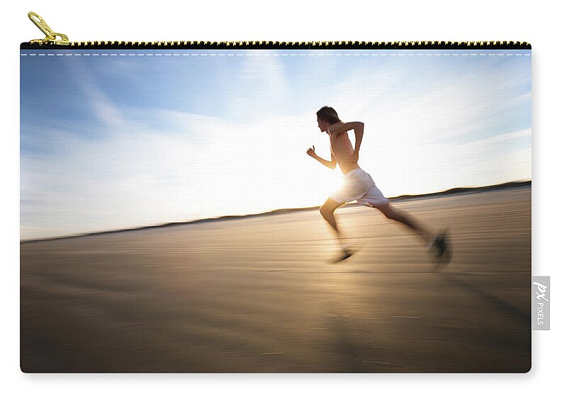 Young Men Zip Pouch featuring the photograph Male Runner Out For A Training Run At by Epicurean