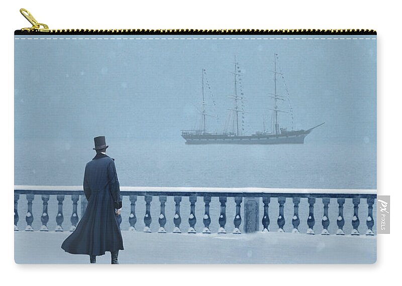 Gentleman Zip Pouch featuring the photograph Man in Top Hat Watching a Ship in Snow by Jill Battaglia