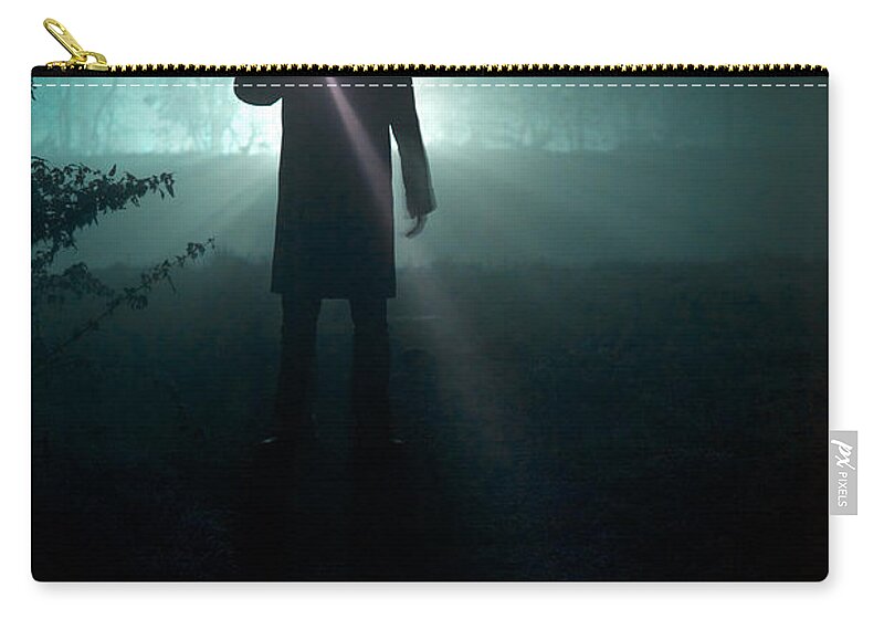 Man Zip Pouch featuring the photograph Man With Flashlight by Lee Avison