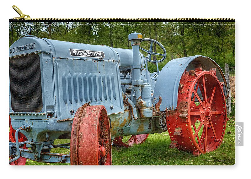 John Deere Zip Pouch featuring the photograph McCormick Deering by Bill Wakeley