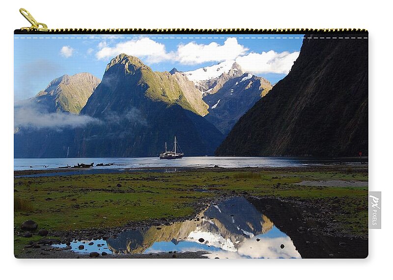 Photograph Zip Pouch featuring the photograph Milford Sound by Cascade Colors