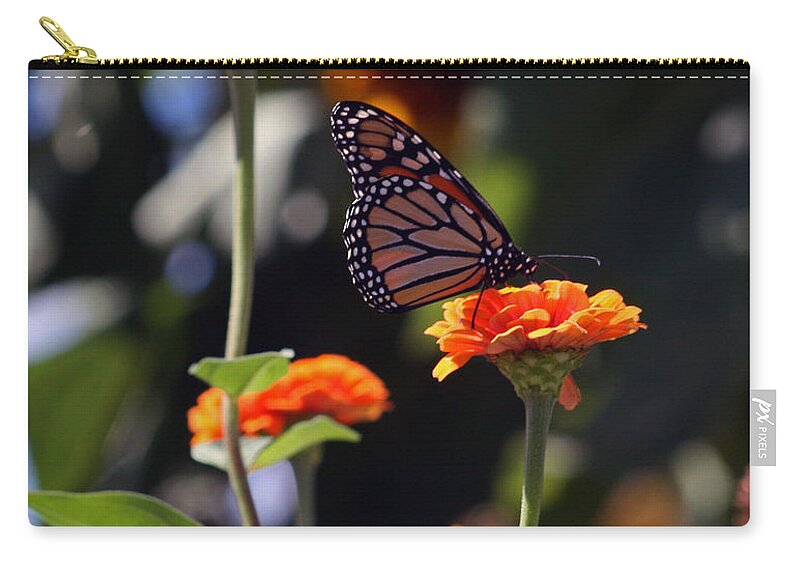 Monarch Butterfly Zip Pouch featuring the photograph Monarch Butterfly And Orange Zinnias by Kay Novy