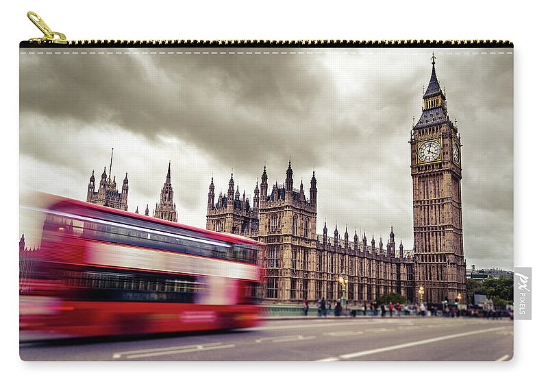 Clock Tower Zip Pouch featuring the photograph Motion Blurred Image Of Double Decker by Filippobacci