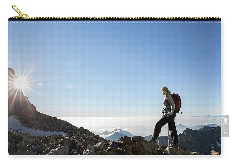 Expertise Zip Pouch featuring the photograph Mountaineer Pasues To Watch Sunrise by Ascent Xmedia
