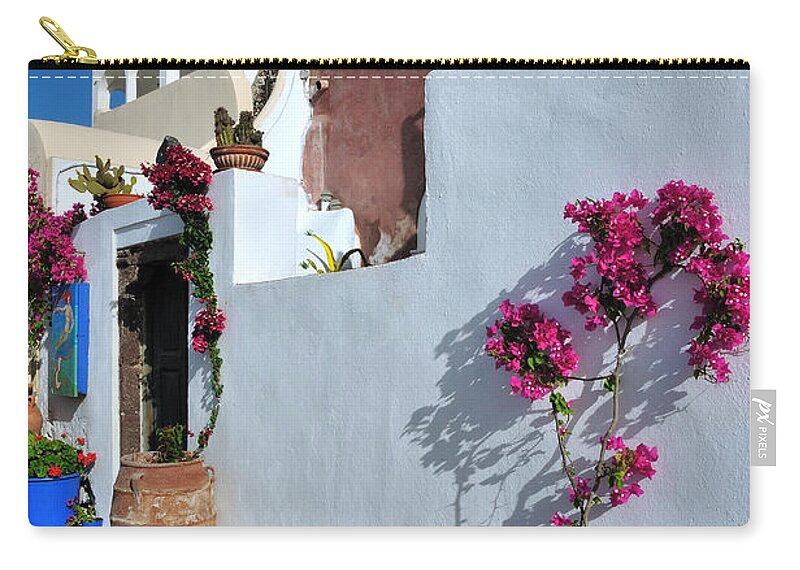 Santorini Zip Pouch featuring the photograph Oia town by George Atsametakis