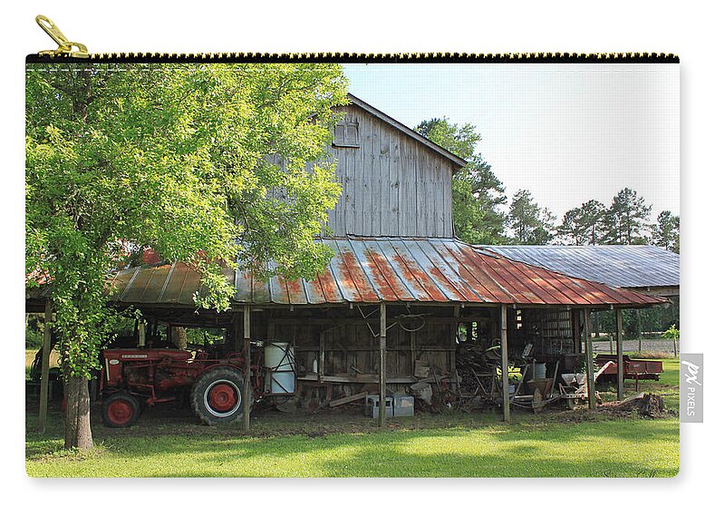 Barn Zip Pouch featuring the photograph Old Barn with Red Tractor by Suzanne Gaff