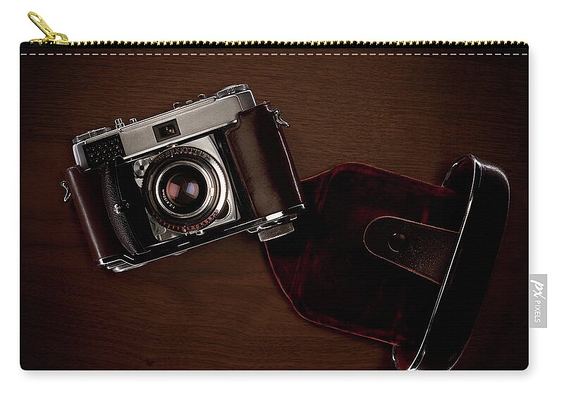 Technology Zip Pouch featuring the photograph Old Camera On Table by Westend61