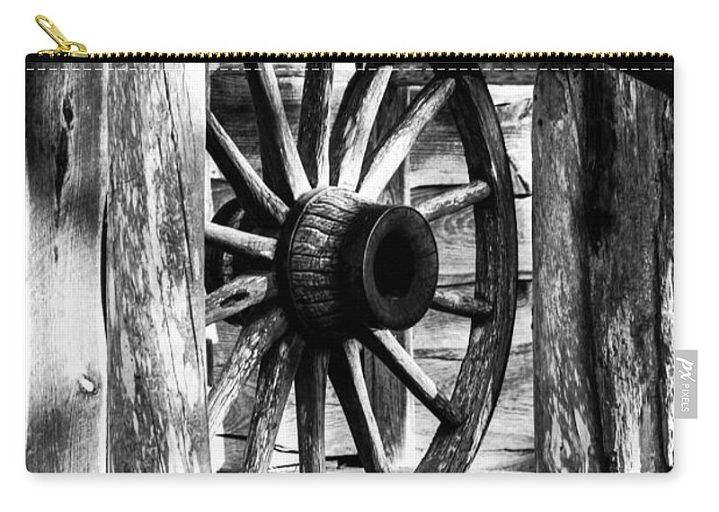 Rural Zip Pouch featuring the photograph Old Wagon Wheel by Debra Forand