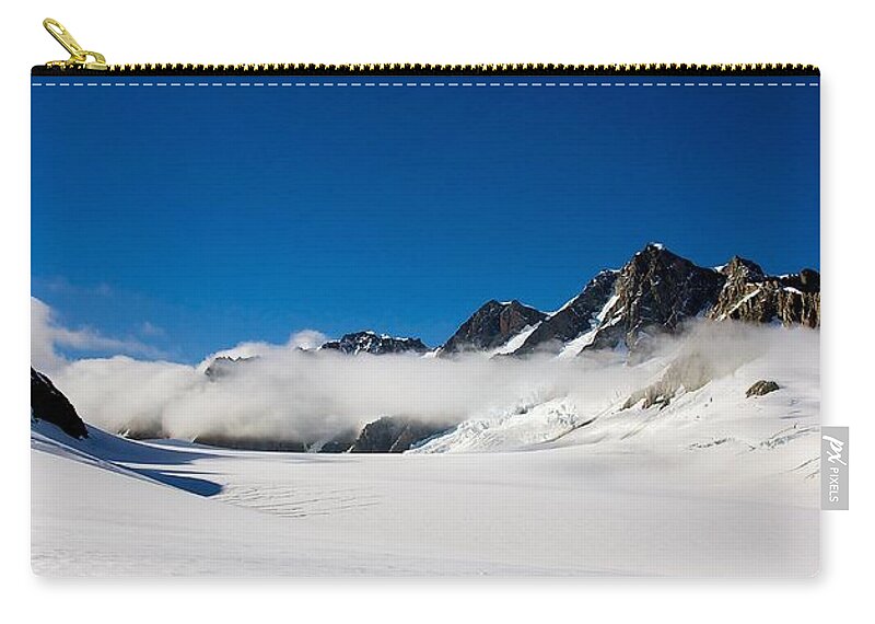 New Zealand Zip Pouch featuring the photograph On Fox Glacier by Stuart Litoff