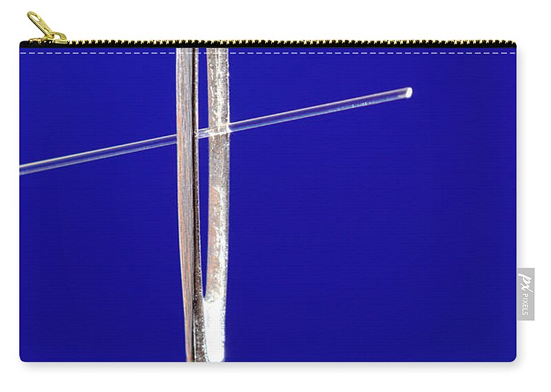 Communication Zip Pouch featuring the photograph Optical Fiber In Eye Of A Needle by GIPhotoStock