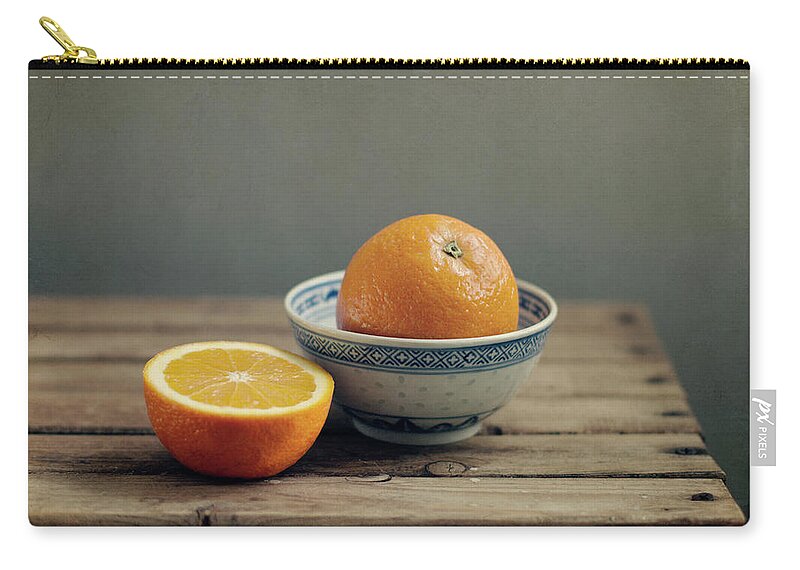 Orange Zip Pouch featuring the photograph Orange In Chinese Bowl And Half Orange by Copyright Anna Nemoy(xaomena)