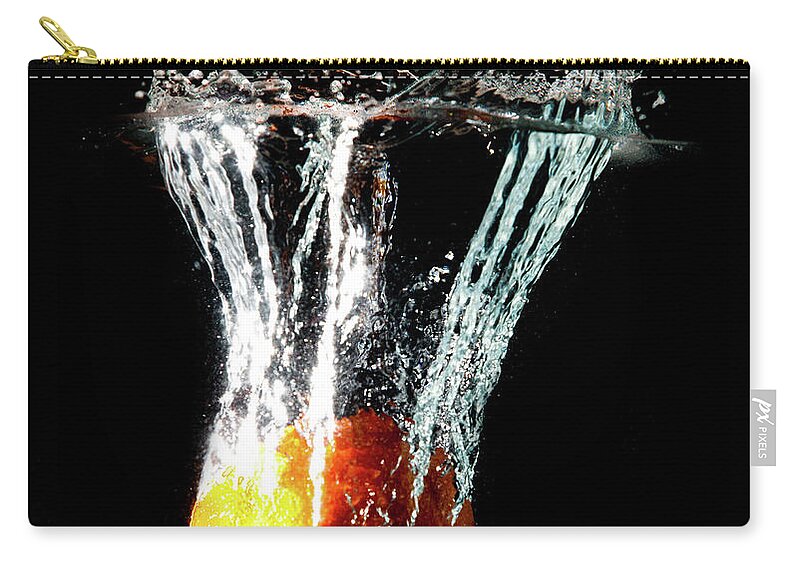 Orange Color Zip Pouch featuring the photograph Orange Water Splash by Matthew Woitunski