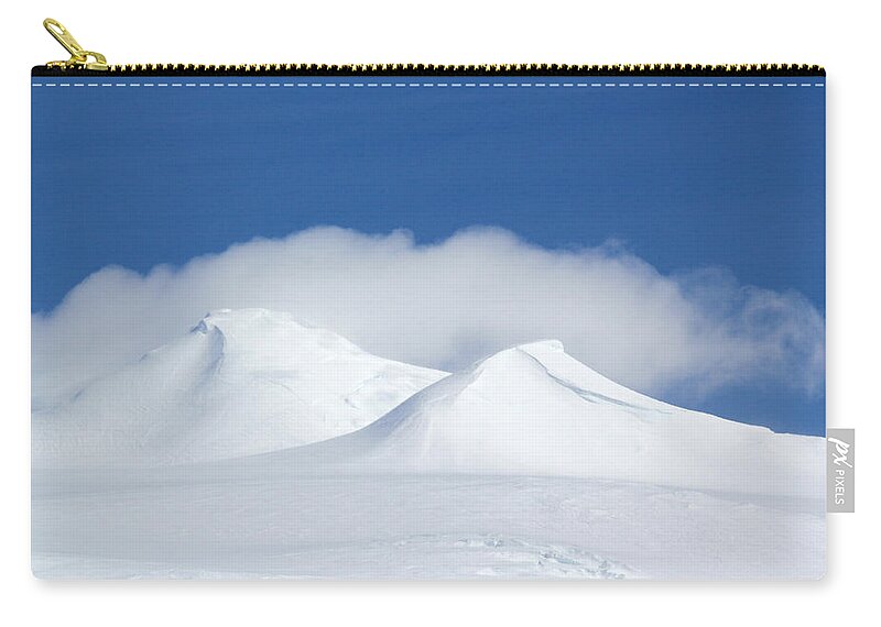 Ice Zip Pouch featuring the photograph Peaks in the Clouds by Ginny Barklow